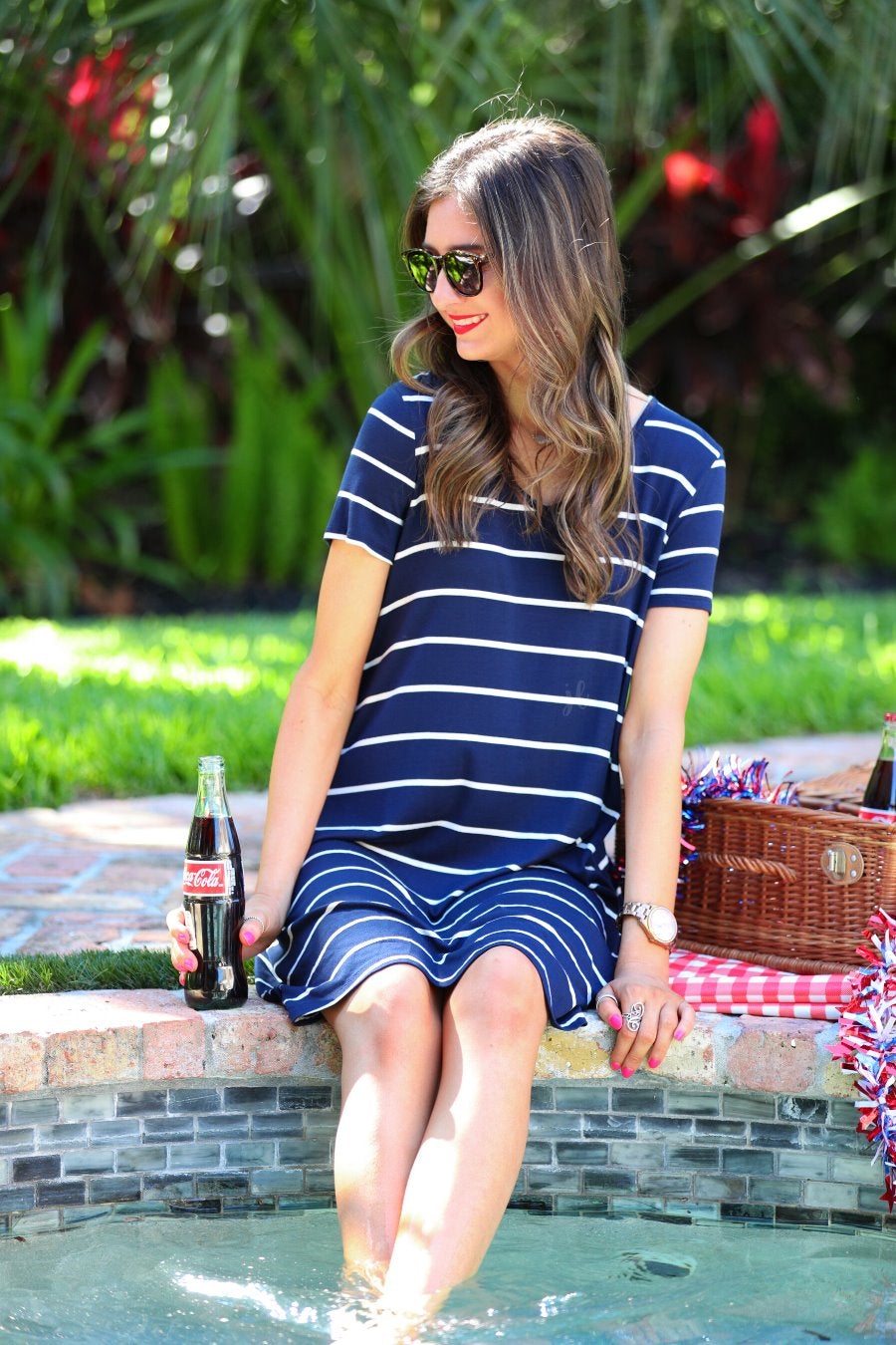 short-sleeve A-line dress with a V-neckline, crafted from ultra-soft fabric in a solid color with horizontal white stripes and a straight hemline in navy