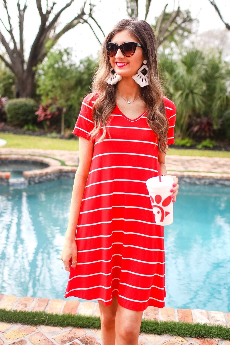 short-sleeve A-line dress with a V-neckline, crafted from ultra-soft fabric in a solid color with horizontal white stripes and a straight hemline in red