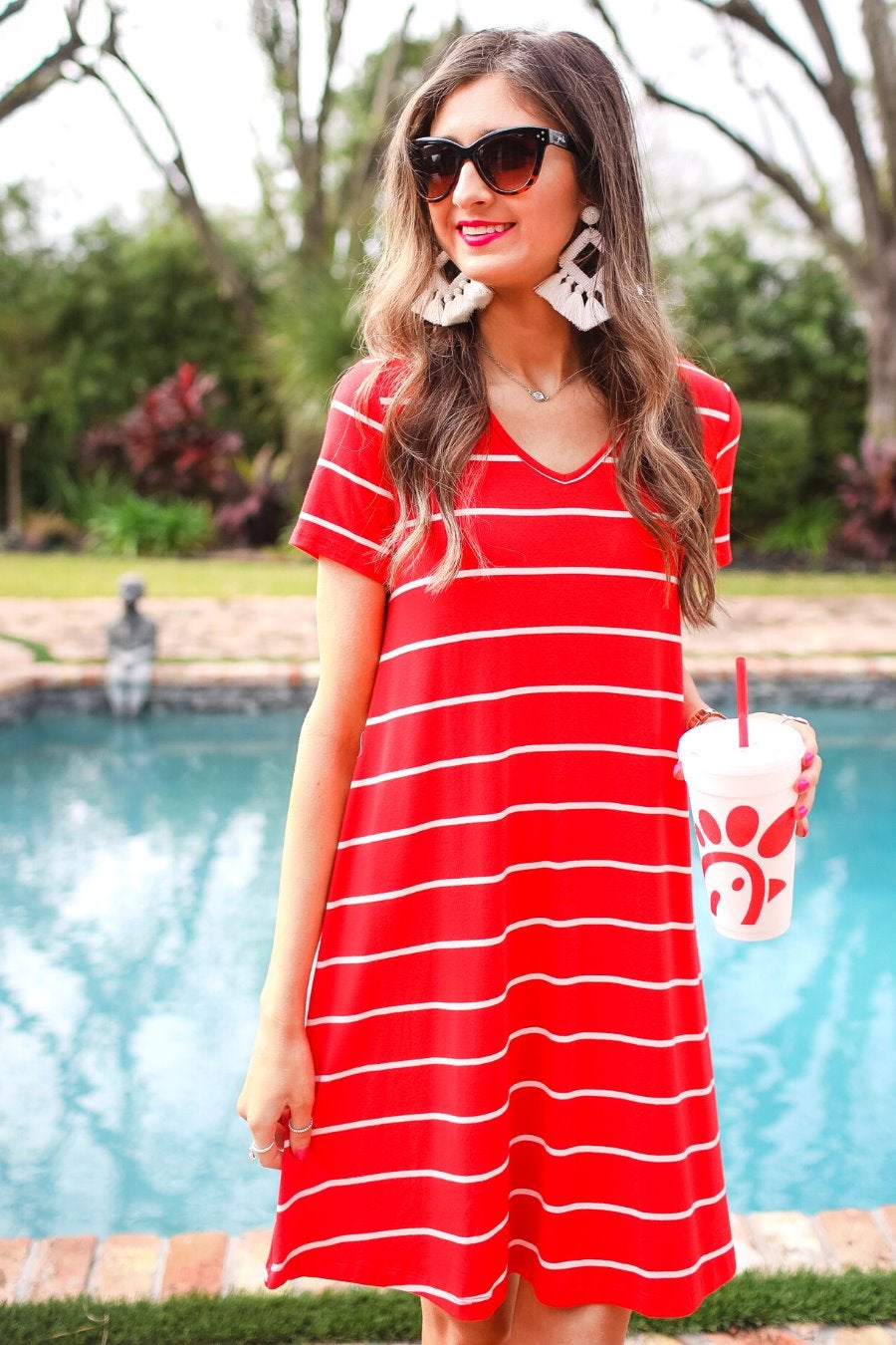 short-sleeve A-line dress with a V-neckline, crafted from ultra-soft fabric in a solid color with horizontal white stripes and a straight hemline in red