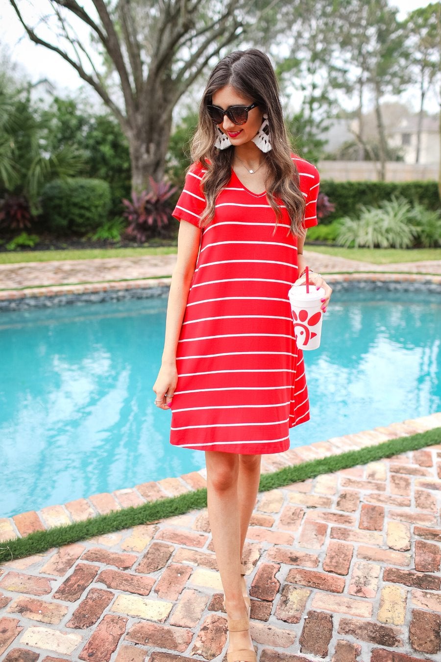 short-sleeve A-line dress with a V-neckline, crafted from ultra-soft fabric in a solid color with horizontal white stripes and a straight hemline in red