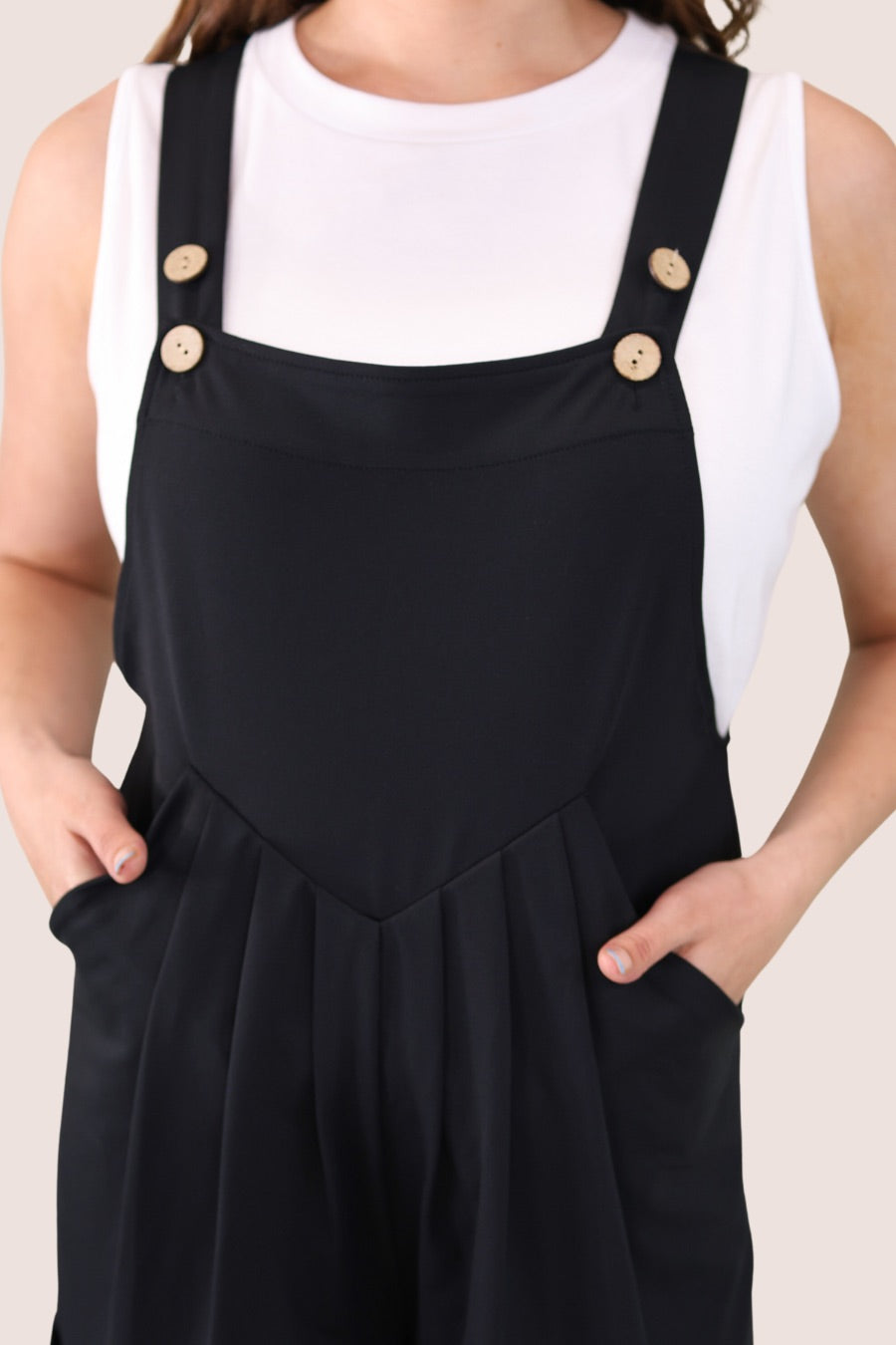 solid black overall shorts made from our best-selling everyday fabric with functional button straps, cuffed hems, and side pockets