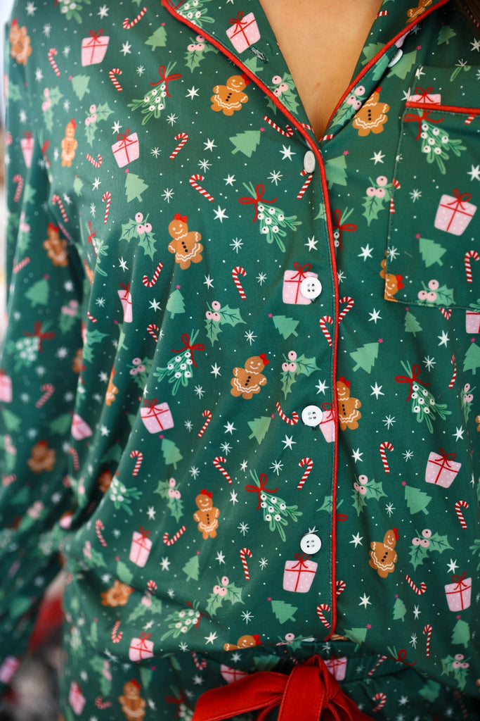 long sleeve top and matching shorts on a custom-designed solid green fabric with a gingerbread girl and a festive holiday print