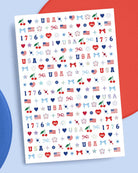 four complete sheets of peel-and-stick nail art with premium CMYK color, iridescent foil, and patriotic icons (bows, cherries, fireworks, flags, hearts, stars, and USA accents)