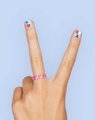 four complete sheets of peel-and-stick nail art with premium CMYK color, iridescent foil, and patriotic icons (bows, cherries, fireworks, flags, hearts, stars, and USA accents)