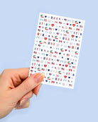 four complete sheets of peel-and-stick nail art with premium CMYK color, iridescent foil, and patriotic icons (bows, cherries, fireworks, flags, hearts, stars, and USA accents)