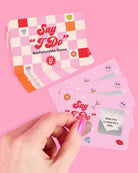 a 25-card bachelorette scratch-off dare card game with pink bridal designs, hidden silver panels, playful prompts, and a compact size for gifting, travel, favors, or GNO fun