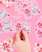 a 25-card bachelorette scratch-off dare card game with pink bridal designs, hidden silver panels, playful prompts, and a compact size for gifting, travel, favors, or GNO fun