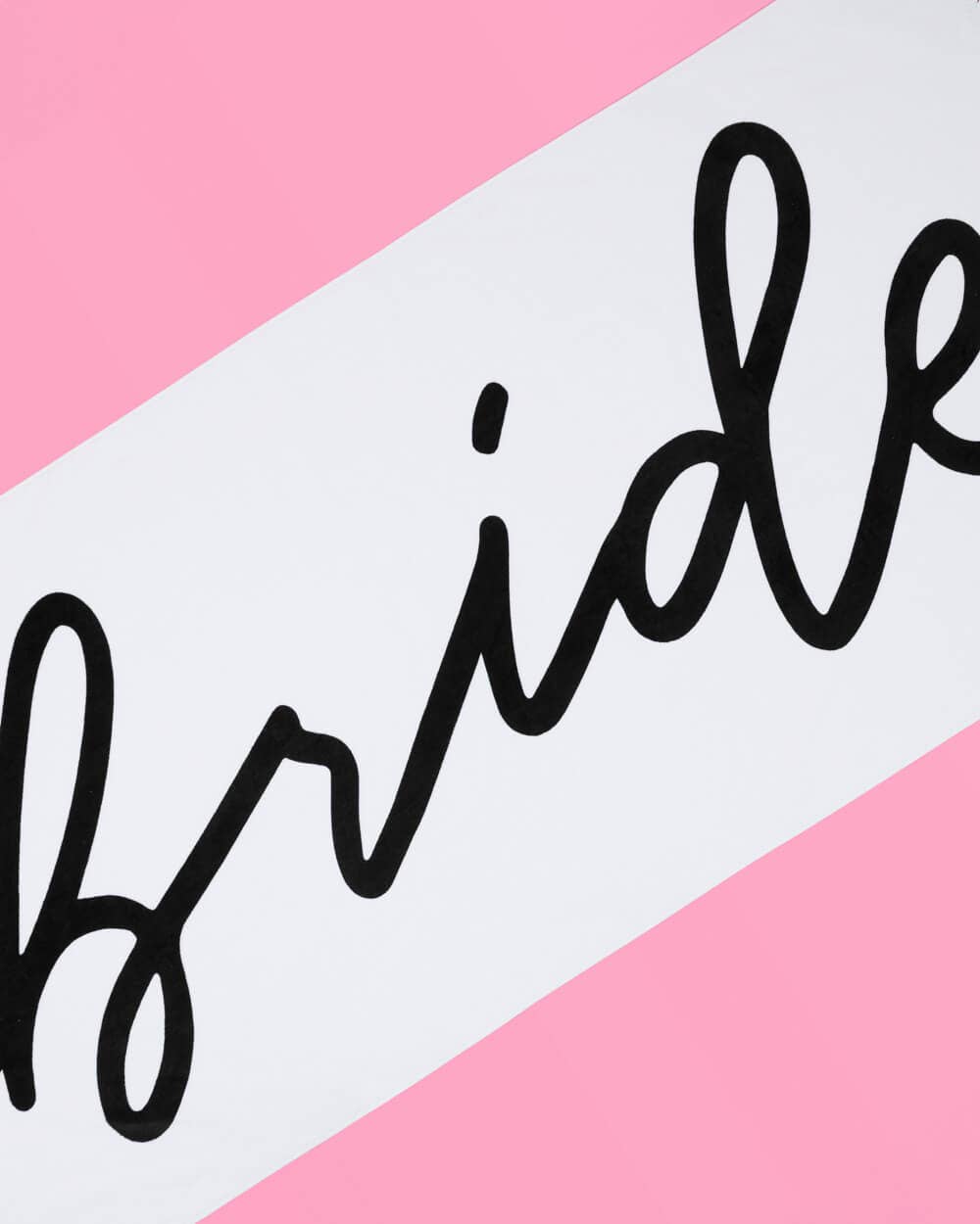 Black 'bride' text on a pink and white striped background