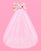 Pink tulle skirt with 'bride to be' text on a pink background