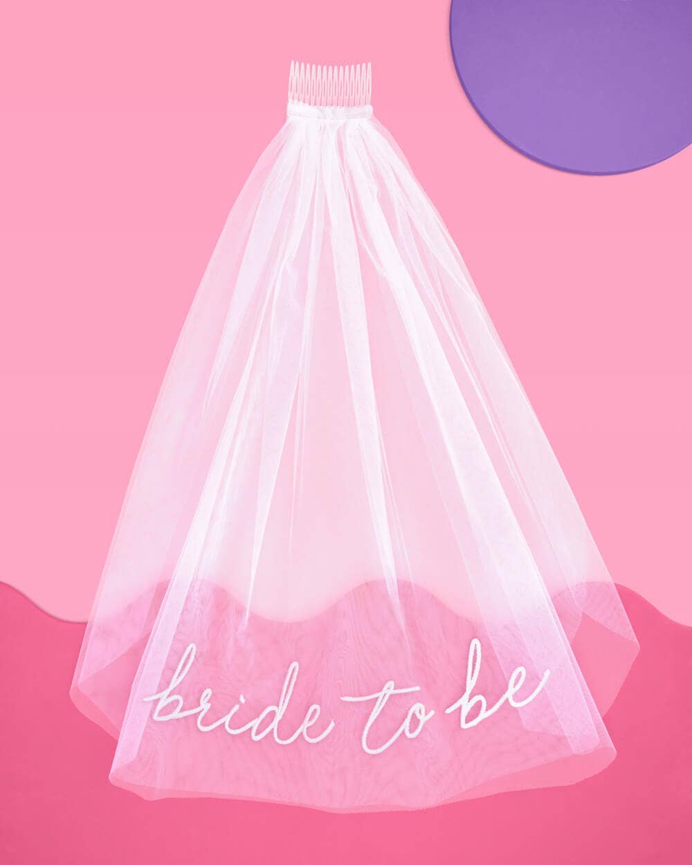 White bridal veil with 'bride to be' text on a pink background