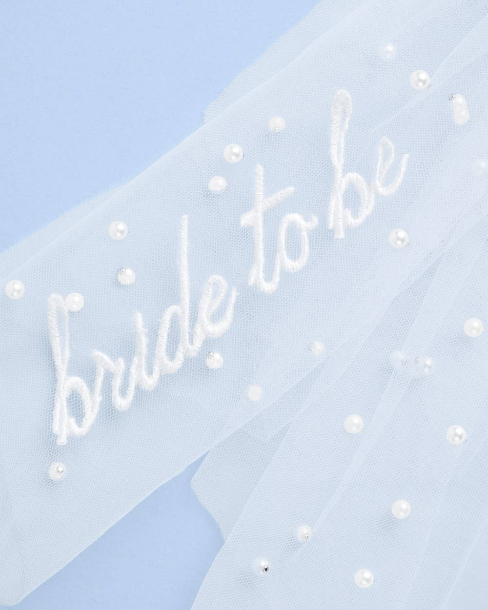 Card with 'bride to be' text on a light blue background