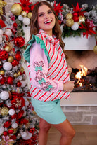 lightweight quilted puffer vest with a festive multicolor candy stripe pattern, snap-front closure, flattering fit, practical pockets, and whimsical teal ruffle shoulder detail