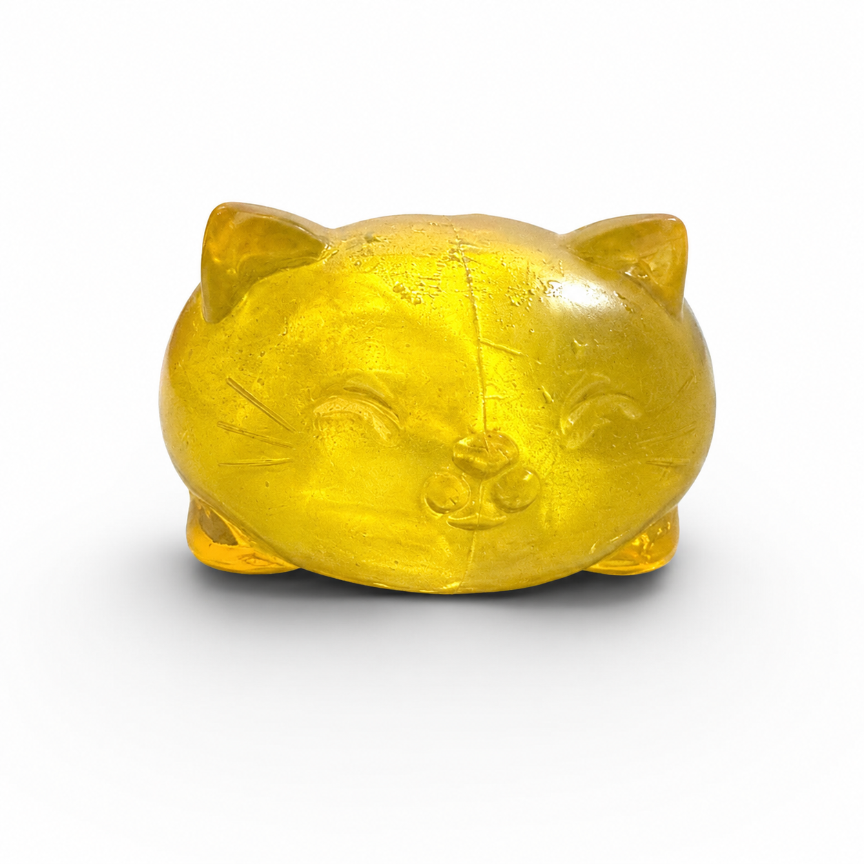 a soft yellow jelly-like chubby kitty squishy with closed eyes, a super slow-rising texture, a stretchy squeezable feel, and a bright translucent color