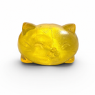 a soft yellow jelly-like chubby kitty squishy with closed eyes, a super slow-rising texture, a stretchy squeezable feel, and a bright translucent color