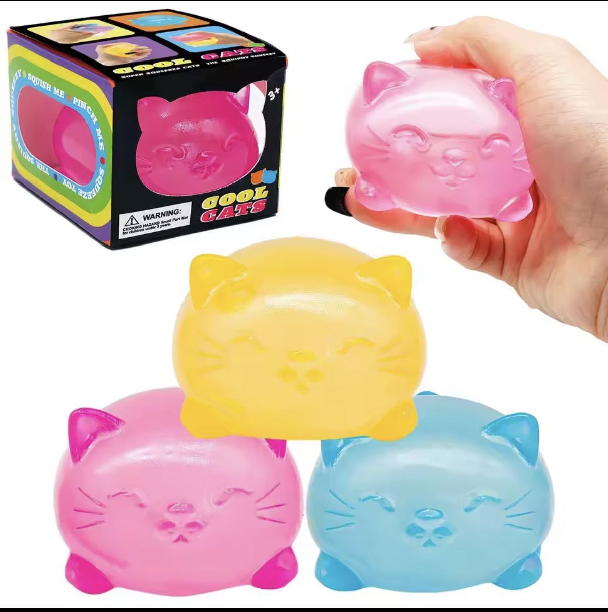 a soft jelly-like chubby kitty squishy with closed eyes, a super slow-rising texture, a stretchy squeezable feel, and a bright translucent color available in blue, pink, purple, and yellow