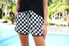 mid-rise, tie waist drawstring, side pockets, & relaxed fit on a black/white checkerboard print