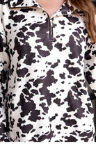 long-sleeve pullover crafted from our best-selling everyday fabric in a bold brown and cream cowhide pattern print, structured collar, functional gold zipper, kangaroo pocket, side slits, and a back yoke seam