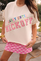 cream short-sleeve mom crop top crafted on a soft, lightweight luxe material with multicolor sequin lettering spelling out CLASSY UNTIL, accented by a gold sequin divider bar, and finished with bold pink chenille KICKOFF lettering outlined in gold sequins