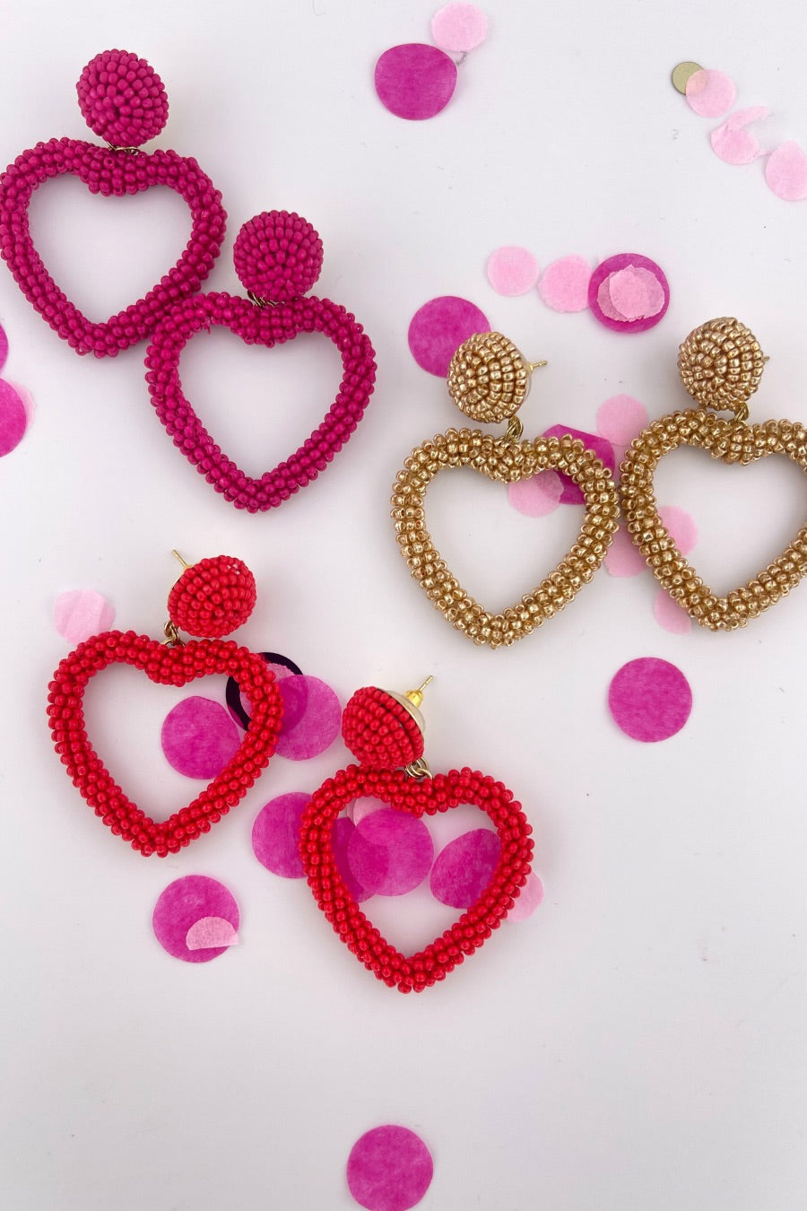 a beaded post stud with a matching beaded open heart-shape drop and a comfort earring back in gold