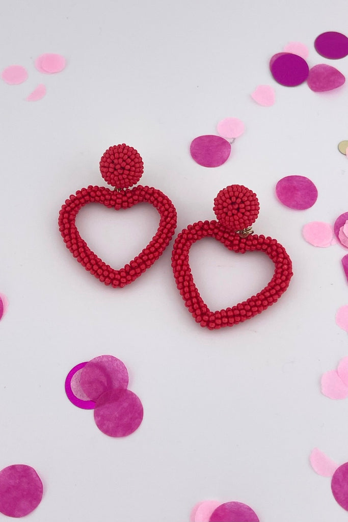 a beaded post stud with a matching beaded open heart-shape drop & a comfort earring back in gold