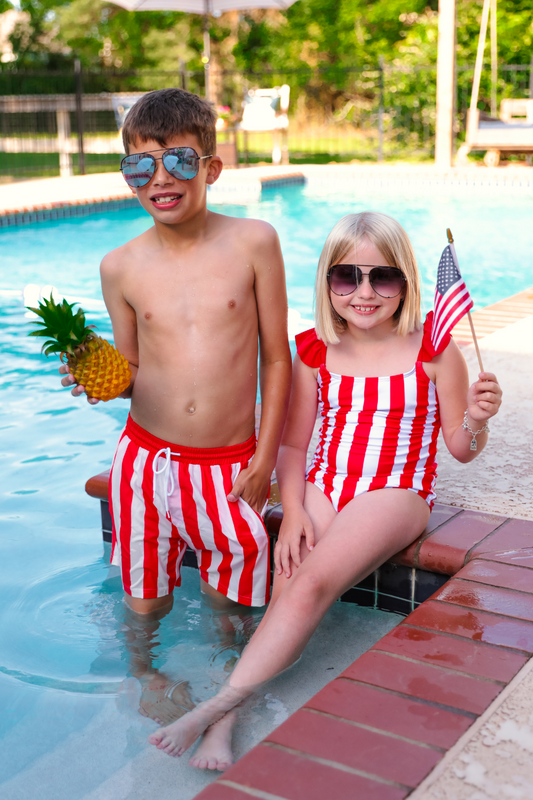 red and white striped swimsuit trunks for boys and one-piece for girls