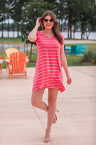 short sleeves, a super soft fabric, a v-neck, an a-line style with a straight hemline, and a solid color fabric with horizontal white stripes