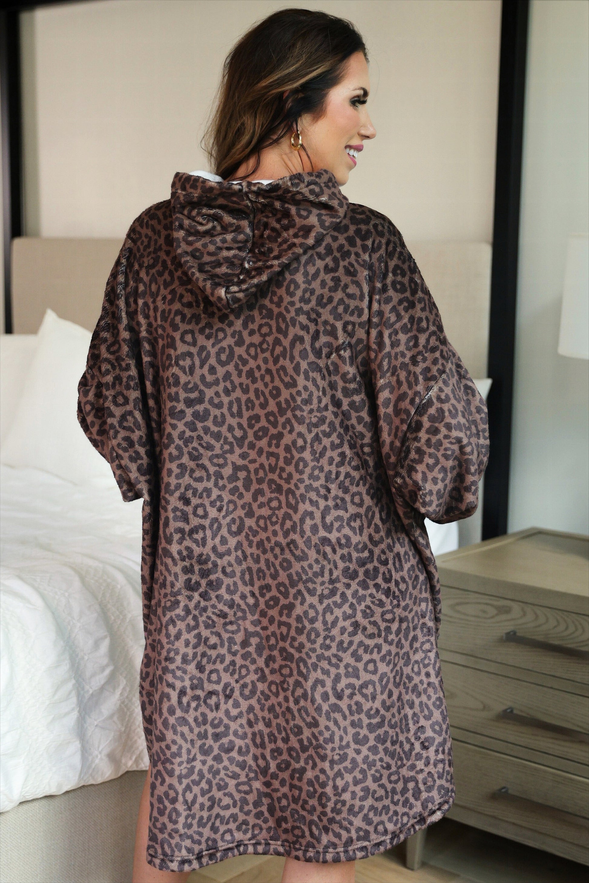 a blanket hoodie with roomy long sleeves finished with soft ribbed cuffs, a slouchy hood, drop shoulder, a kangaroo pouch on ultra plush fabric in Coco Leopard (Leopard)