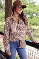 long-sleeve shacket with a foldable collar, button-up open front, and two chest pockets on a tan and white textured fabric