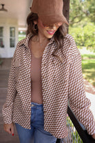 long-sleeve shacket with a foldable collar, button-up open front, and two chest pockets on a tan and white textured fabric