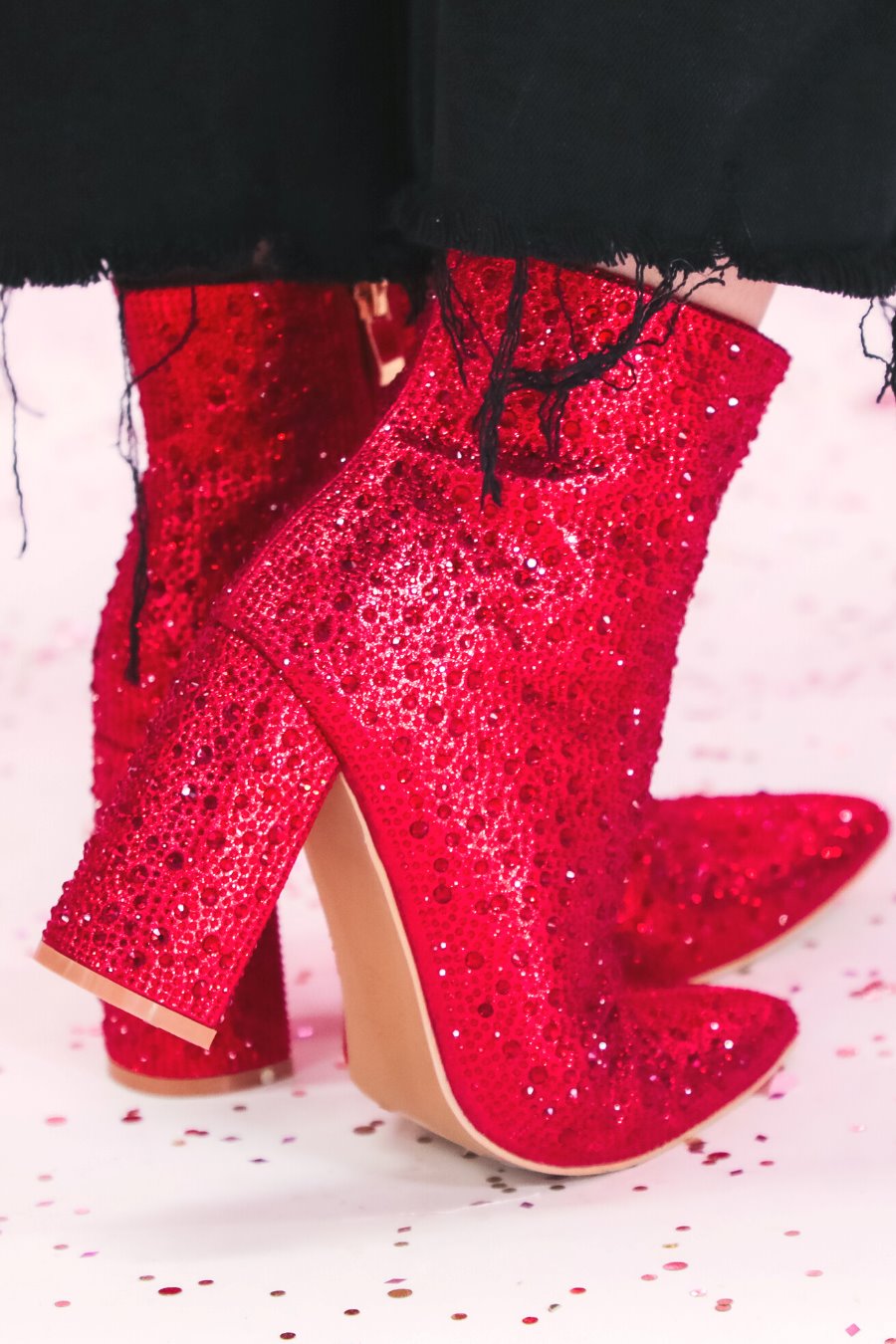rhinestone-covered booties with a pointed toe, front seam, inside zipper, cushioned flatbed, and a 4" block heel in red