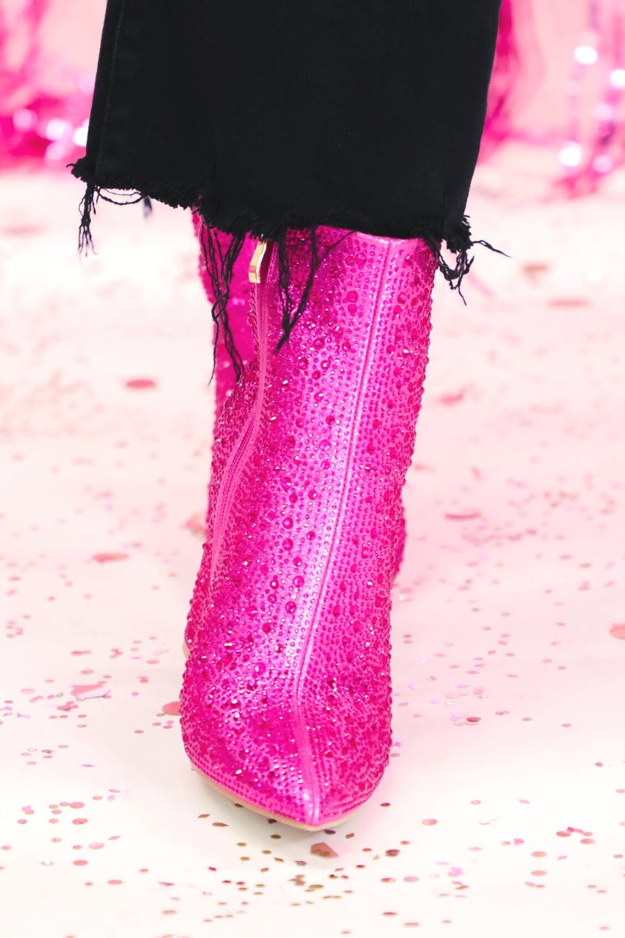 rhinestone-covered booties with a pointed toe, front seam, inside zipper, cushioned flatbed, and a 4" block heel in pink