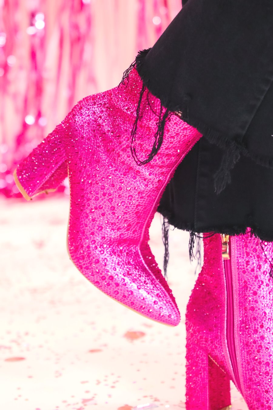 rhinestone-covered booties with a pointed toe, front seam, inside zipper, cushioned flatbed, and a 4" block heel in pink