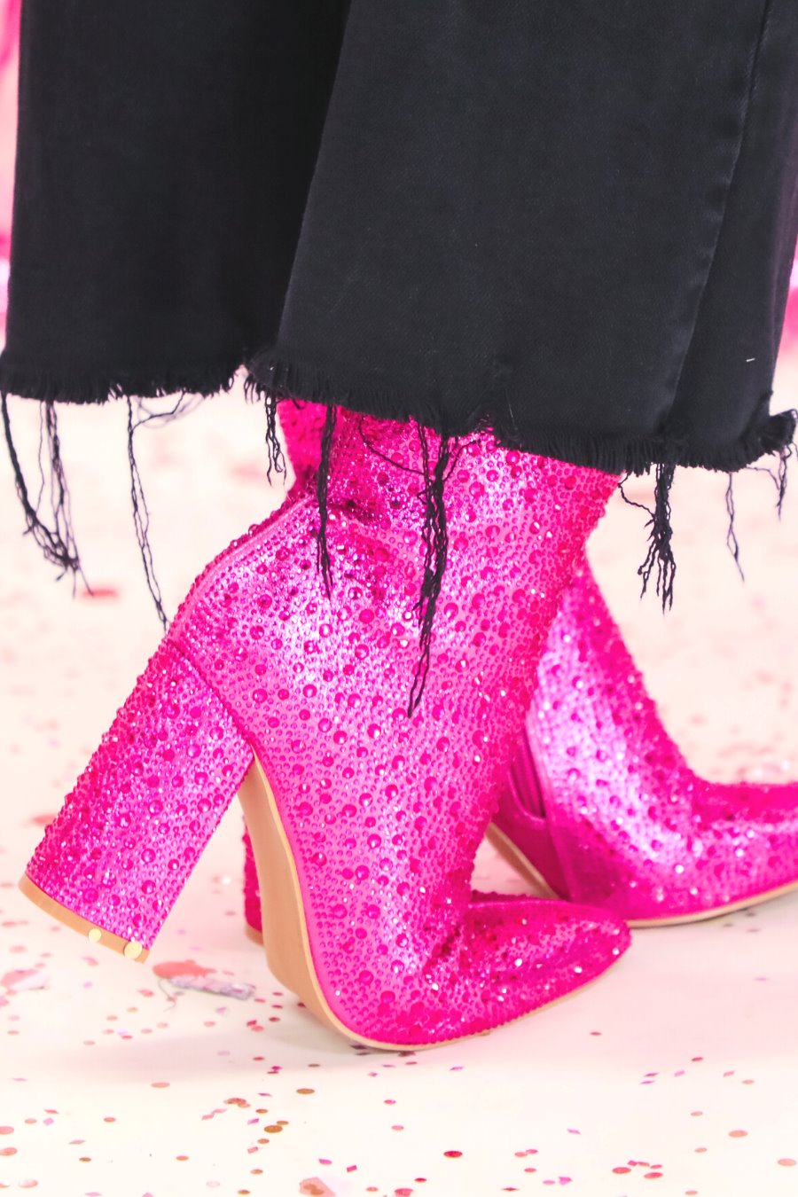 rhinestone-covered booties with a pointed toe, front seam, inside zipper, cushioned flatbed, and a 4" block heel in pink
