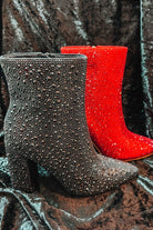 rhinestone-covered booties with a pointed toe, front seam, inside zipper, cushioned flatbed, and a 4" block heel in black and red