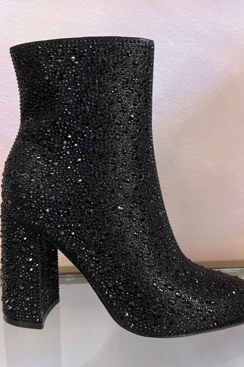 rhinestone-covered booties with a pointed toe, front seam, inside zipper, cushioned flatbed, and a 4" block heel in black