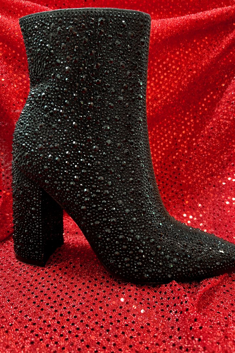 rhinestone-covered booties with a pointed toe, front seam, inside zipper, cushioned flatbed, and a 4" block heel in black