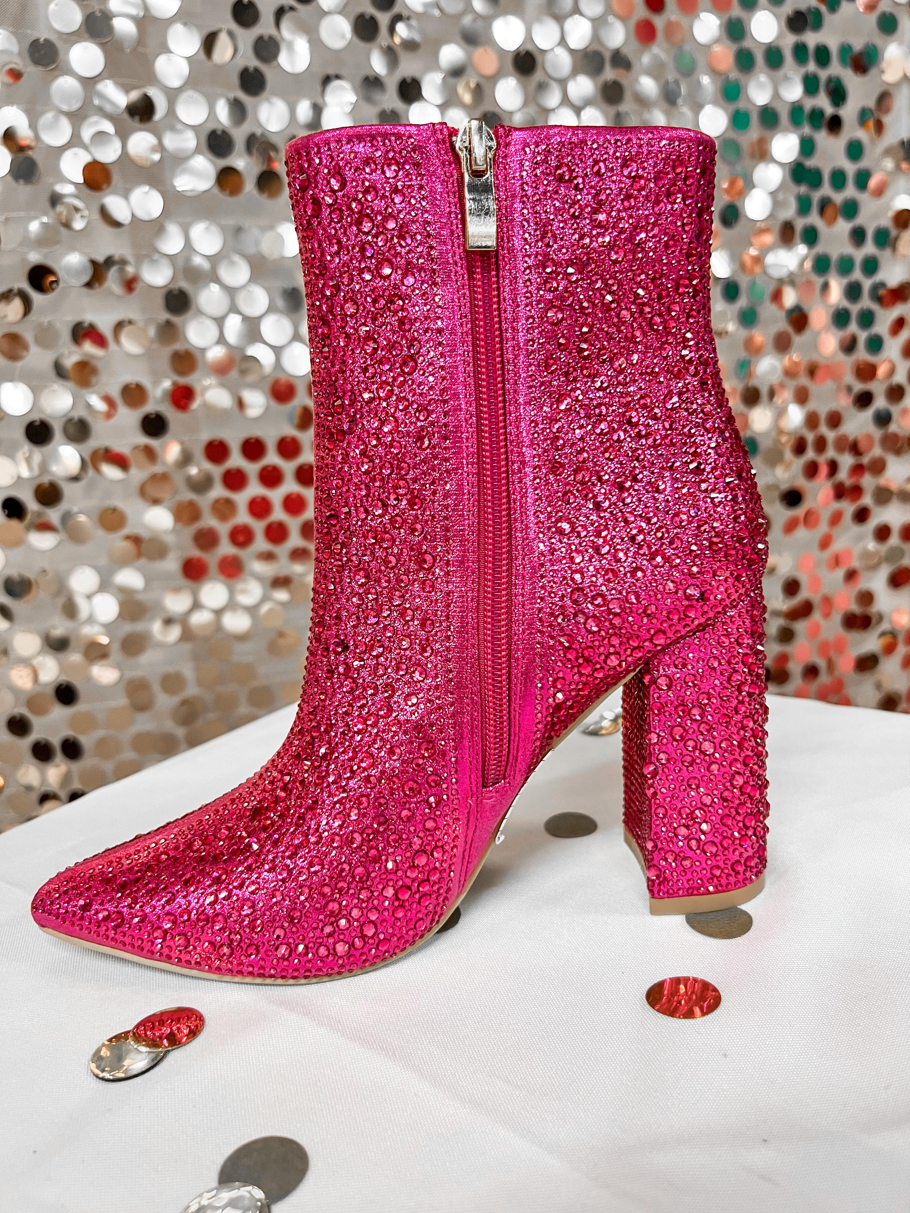 rhinestone-covered booties with a pointed toe, front seam, inside zipper, cushioned flatbed, and a 4" block heel in pink