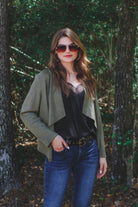 draped open-front silhouette jacket, crafted on a super soft faux suede material with long sleeves, an angled front cropped hem, and subtle seam details on the back in olive