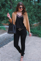 draped open-front silhouette jacket, crafted on a super soft faux suede material with long sleeves, an angled front cropped hem, and subtle seam details on the back in camel