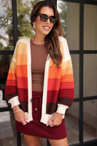 long-sleeve open front cardigan, finished in a vibrant ombré of cream, gold, orange, and rust tones on a soft knit fabric