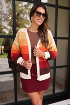 long-sleeve open front cardigan, finished in a vibrant ombré of cream, gold, orange, and rust tones on a soft knit fabric