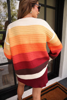 long-sleeve open front cardigan, finished in a vibrant ombré of cream, gold, orange, and rust tones on a soft knit fabric