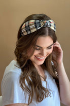 top knot headband crafted from soft, lightweight material with a classic autumn hue plaid on a tan base