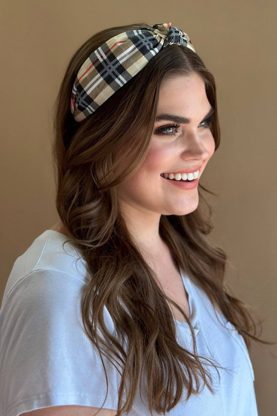 top knot headband crafted from soft, lightweight material with a classic autumn hue plaid on a tan base