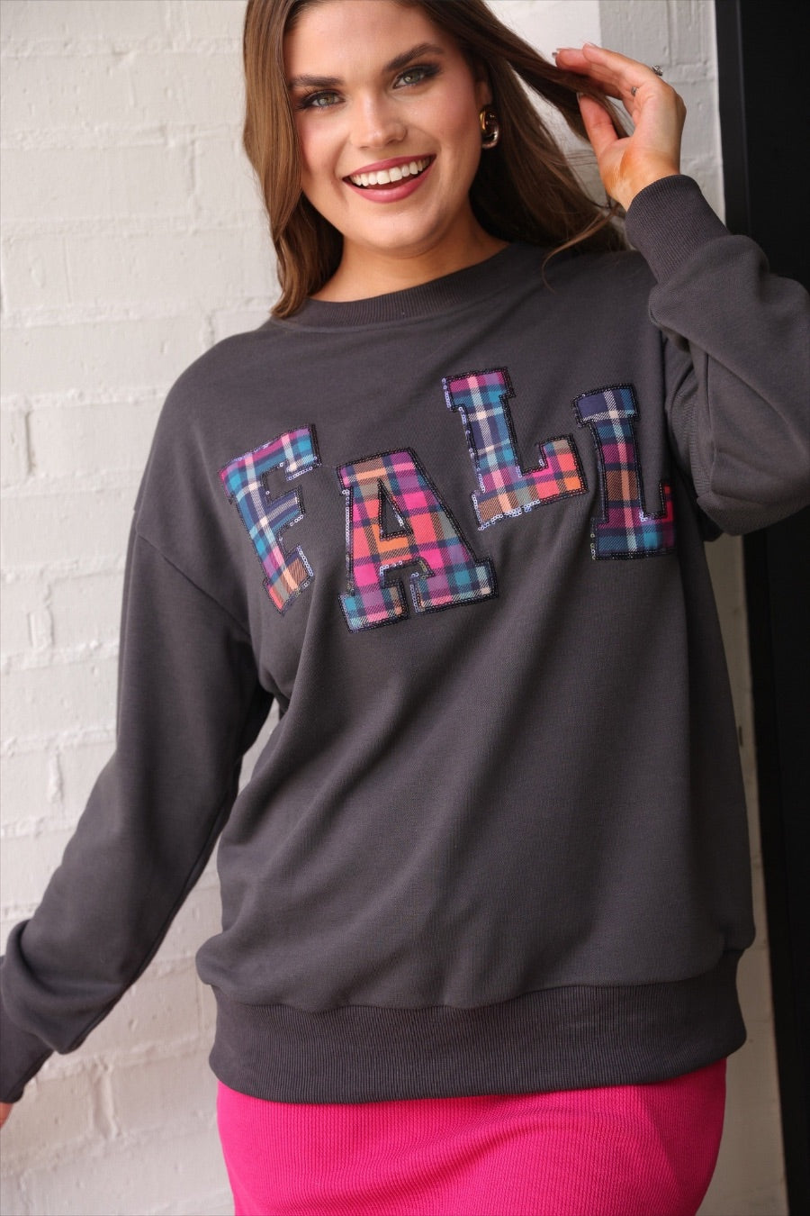 long-sleeve gray pullover with plaid 'FALL' letters in our exclusive Patterned In Plaid print, each outlined in sequins on a soft, cozy fabric