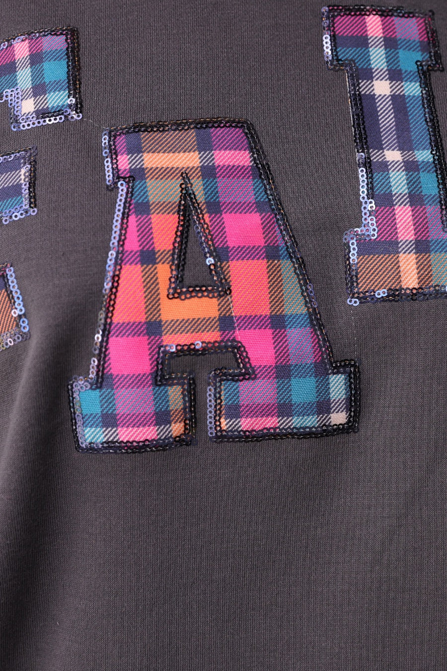 long-sleeve gray pullover with plaid 'FALL' letters in our exclusive Patterned In Plaid print, each outlined in sequins on a soft, cozy fabric