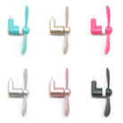 Six small L-shaped magnetic fan propellers arranged in a 2x3 grid on a white background, shown in aquamarine, gold, neon pink, platinum, rose gold, and slate. Each fan has a visible Tech Candy logo on the side.