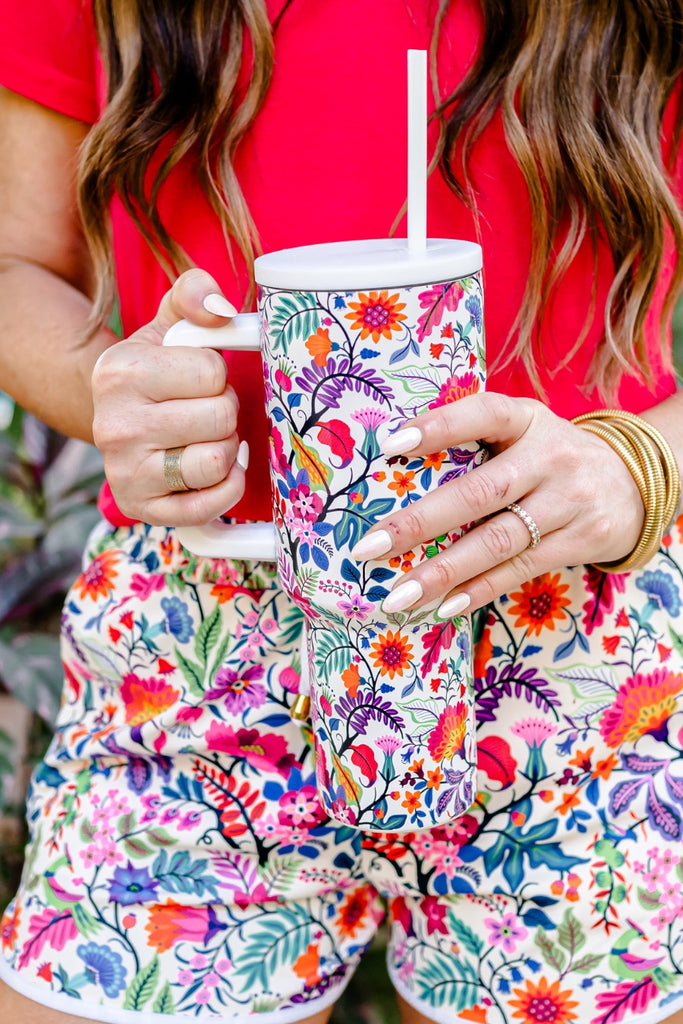 40 oz tumbler cup in our popular Fiesta Time in white with a reusable straw, handle, screw-on lid, car cup holder compatible, and dishwasher safe