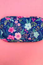 navy floral pattern travel bag with a zipper closure and a chenille patch bearing MAMA