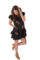 frilly ruffle sleeves & a tiered ruffle bottom adorned with a sequin football pattern on black fabric